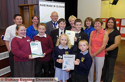 ALL smiles . . . (back, from left) Paul Douglas, Crompton House; Tamsin Morris, Groundwork; Deputy Mayor, Councillor David Jones; Councillor Jackie Stanton; Suzanne Walton, Groundwork; Judith Haughton, Fairtrade in Oldham; and Dixa Vaja, road safety travel plan. Front: Georgia Wild and Rowan Curran, Beal Vale; Nathan Worrall and Thomas Allen, Crompton House; and Olivia Wood and Lewis Skeldon, Thorp Primary