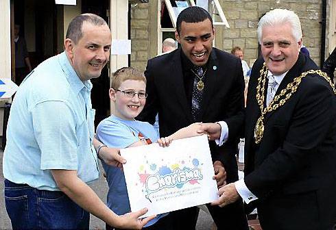 WELL done . . . Councillor Hindle, Samuel Biggs, Mohammed Adil and Oldham Mayor Councillor Jim McArdle with the winning design 