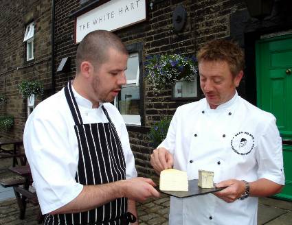 CHEESE PLEASE . . . Actor Sean Wilson with two of his new cheeses and White Hart head chef Paul Cookson 