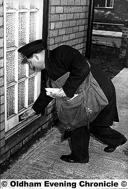 An image of the past? An Oldham postman delivers the mail on foot back in 1959