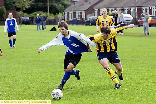 GETTING SHIRTY: Chaddy End’s Gaz Pickup (right) and High Crompton’s Carl Dean battle for the ball in their Oldham Sunday League clash.