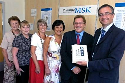 ALL smiles . . . Dr Alan Nye (right) with the customer service excellence award and (from left) patients Beryl Wild, Margaret Collins, Brenda Iles and Norma Nutter, and assessor Bob Mandy