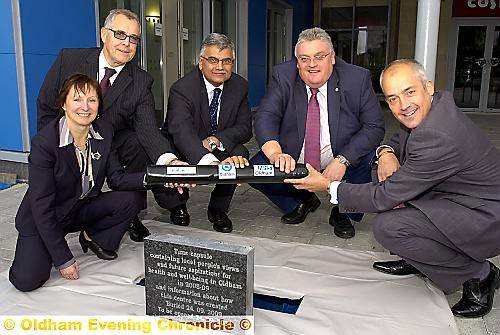 Time capsule goes in... eft to right, Gail Richards (chief exec. NHS Oldham), Neil Charlesworth (Community First), Riaz Ahmad (chairman NHS Oldham), Cllr. Howard Sykes (leader of Oldham Council), Charlie Parker (chief exec. OMBC).
DAM09-09-24/05P