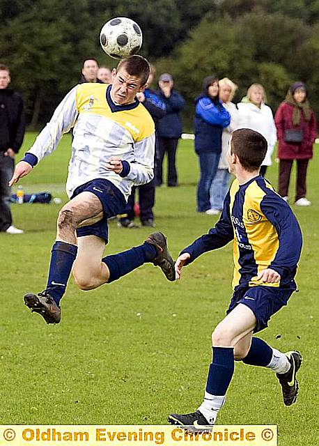 HIGH-FLYER: Michael Taylor of Chaddy End FC under-16s, wins a header against Manchester North End. 