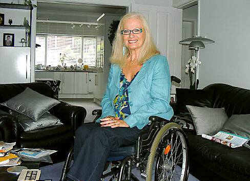 TODAY . . . polio sufferer Gill Lees now uses a wheelchair when she leaves her home 