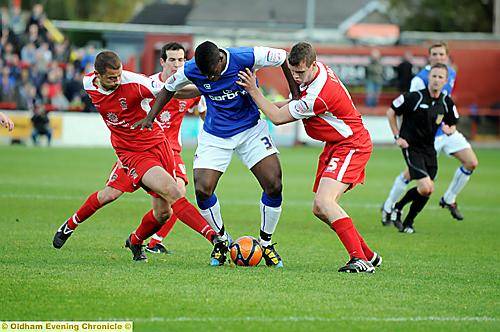 Oumare Tounkara finds it tough going against the Acrrington defence