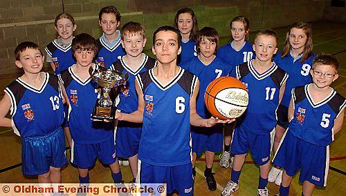 Saddleworth School Year 7 Basketball Team : left to right, back: Lucy Ready, Paige Gardner, Ruth Teal and Ella Samuels. Middle: Daniel Holmes, George Kilgour, Billy Barnes, Harry Lord, Harry Warhurst and Tony Gallagher. Front: Alastair Lloyd (captain). 