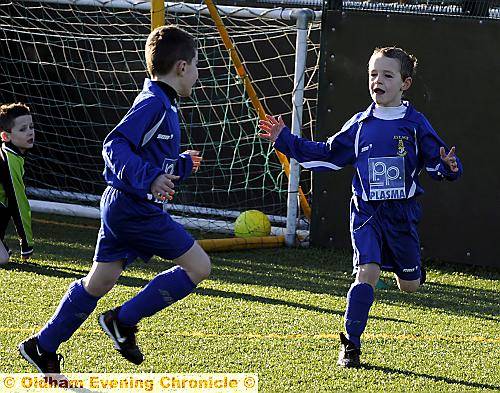 PUT IT THERE: Bailey Marsden celebrates one of his two goals for Boundary Park Juniors under-eights against Moston Brook. 