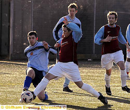 TOE TO TOE: Heyside’s James Taylor (left) nicks the ball away from Matthew Walmsley. 