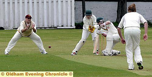 Royton’s Liam Mason meets Alan Durose’s delivery. 