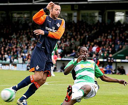 THAT’S MINE: Athletic striker Pawel Abbott is beaten to the ball by Yeovil’s Nathan Smith.