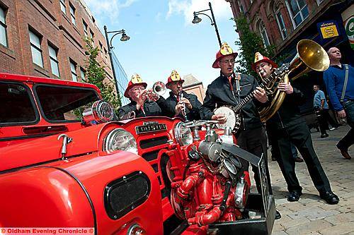 The Big Top Band donned firemen’s’ helmets to play alongside a 1961 Austin fire tender. To see or order all our pictures from this event, click the “Buy a Photo” link at the top of the page 
