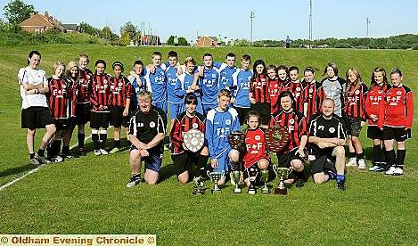 ON PARADE: Teams and officials from ROCS FC show off their silverware from a successful season in the North Manchester Girls League and Tameside Sunday League. 