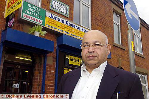 Mumtaz Kahn outside his Werneth shop which he renamed in honour of his son 