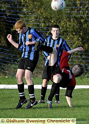 ACROBATIC: James Larty of Chadderton Juniors under-14s attempts an overhead kick against Avro. Larty went on to score a hat-trick in a 4-2 victory.