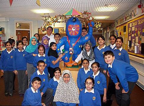 WE did this . . .Year 6 pupils show off their finished mascot 
