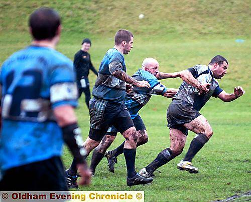 ON THE CHARGE . . . Fitton Hill’s Eddie Aspin makes ground in search of the Chester line. 