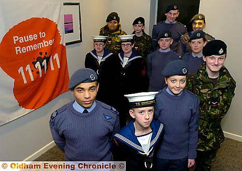 PROUD to do their bit . . . front (from the left) Flt Sgt Jordan Crowther (Oldham ATC), Cadet Christopher Marsland (Oldham Sea Cadets), Cadet Katy Webster (Saddleworth Air Cadets), L/Cpl Jack William Cook (Oldham Army Cadet Force) 