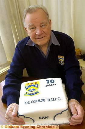 PIECE OF CAKE... Sam Molineux celebrates his landmark with a special treat. 