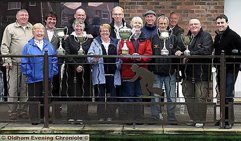 TROPHY TIME . . . winners, officials and sponsors at the completion of finals day in the Inbev Winter Bowls League at Chadderton Cot.