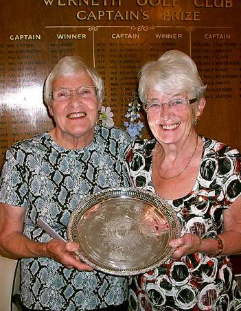 ALL YOURS . . . Joan Swindells receives the Marie Hufton Salver from lady captain Joyce Bielby. 
