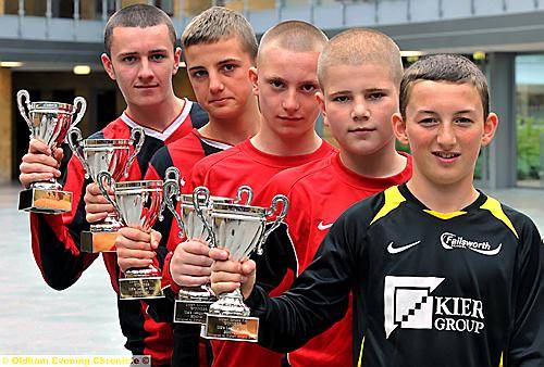 TROPHY TIME... captains Sam Jones (Year 11s, left) Nathan Chorlton (Year Eights), Luke Daly (Year 10s), Charlie Fuller (Year Nines), Mason Fawes (Year Sevens). 