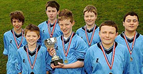 CUP OF CHEER . . . Saddleworth School Year Eights boys team of Harry Lord (back row, left), Thomas Howe, Mark Williams, Elliott Knight. Tom Gallagher (front, left), Sam Ireland and Mark Williams. 