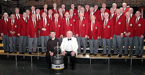 Triumphant . . . the Saddleworth Male Voice Choir with the trophy 