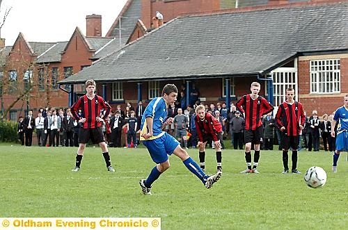 Jack Nutter slides home Hulme’s fourth strike, from the penalty spot.