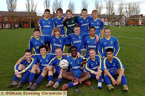 HULME captain Obe Ebizie (centre) proudly holds the Knock-out Cup. PICTURE by VINCENT BROWN