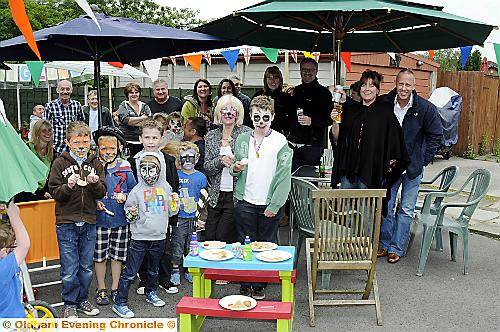 Sandra Whelan ( centre ) with her neighbours and friends at her home in Middleton Road, Chadderton for the Big Lunch Event 
