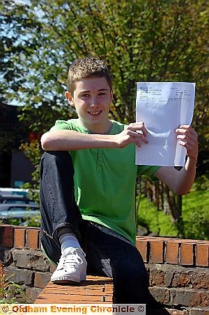 A-STAR: Daniel McLoughlin (13) with his A* GCSE result in maths  