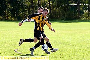 CLOSE ENCOUNTER: Gareth Armstead, of Fitton Hill, shields the ball from a Royton FC opponent. 
