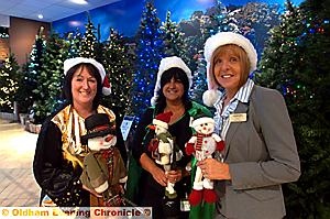 SLEIGH bells ringing ... Getting in the festive spirit in September at Housing Units are staff membeers (from the left) Julie Yarwood, Joanne Fox and Pat Garlick 
