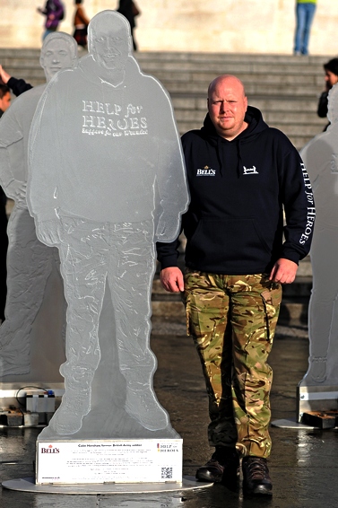 PROUD moment: Ex-Fusilier Colin Henshaw stands beside the statue of himself in Trafalgar Square 
