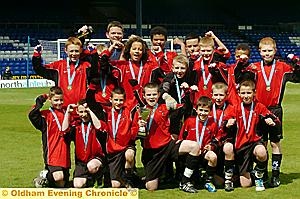 GET IN . . . captain Ben Ingham and his Failsworth School team-mates have plenty to smile about after being crowned the Year Sevens champions. 
