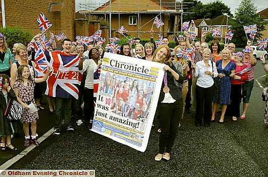 MAKING THE NEWS... Nicola White with a giant front page of the Oldham Chronicle reporting her Olympic success. 
