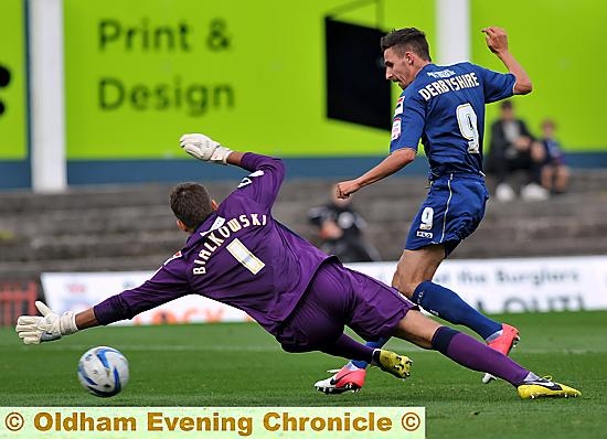 INSTANT IMPRESSION . . . new loan signing Matt Derbyshire slots home Athletic’s equaliser. 