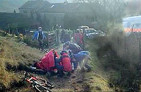 Rescuers help the mountain biker 
