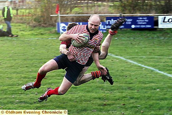 Gareth Barber scores a try for Oldham. 