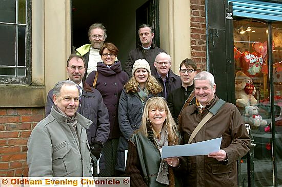 Major sponsors seeing how their money will be spent at the George Street Chapel . . . (back row), Andrew Fielding (Age UK), Adrian Walker (Lambert Walker, contractors); (centre, from the left) Henry Owen-John (English Heritage), Sara Hilton, Laura Whalley (Heritage Lottery Fund), Jeff Hinchcliffe (Age UK), Gavin Richards (Architectural Heritage Fund); (front, from the left) Sandy Roy (Heritage Lottery Fund), Yvonne Lee (chief executive Age UK Oldham) and John Prichard (architect)