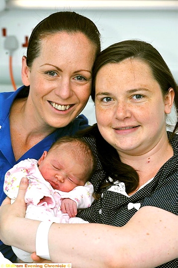 BABY joy: mum Sarah Wardhaugh with baby Grace and midwife Lisa Crossley Oldham-born baby shares big day with new prince. 