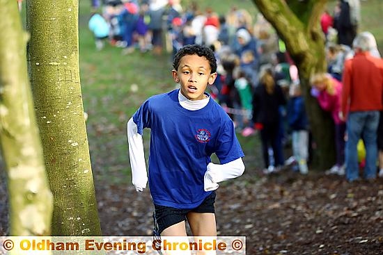 VICTORY CHARGE . . . boys’ Year Five/Six race winner Michael Obi from St Thomas’s Leesfield.