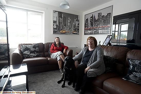 Progress pic of Crossley estate, Chadderton during major refurbishment. Pic shows Petworth Road resident, partially-sighted Katherine Haslam (right) with her personal assistant Caroline Moloney and guide dog Bea.
