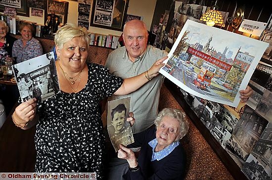 Whitehouse Inn, Henshaw Street,Oldham Mumps re-union.

Pictured here is Landlady Joan Hague with all the way from Essex Tony Curtis who left in 1975 when he joined the army and his mum Alice Curtis with an old pic she took of Tony.