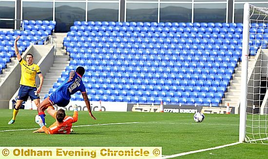 Dominic Poleon latches on to a loose ball to put Athletic in front.