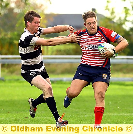 ACTION MEN: Phil Graham fends off a would-be tackler