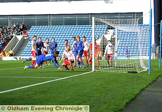 STOOP TO CONQUER . . . Danny Philliskirk gets down low to nod home at the far post and give Athletic an early lead. ALL PICTURES: Alan Howarth
