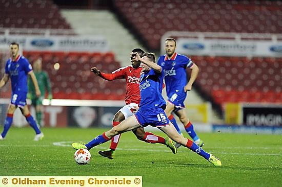 TOTAL COMMITMENT . . . Carl Winchester shows the spirit and effort shown by Athletic’s players