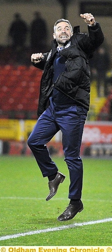 HIGH: Athletic manager David Dunn punches the air in delight after Danny Philliskirk’s late winner. It was a different story earlier as a head-in-hands Dunn watched Swindon equalise.